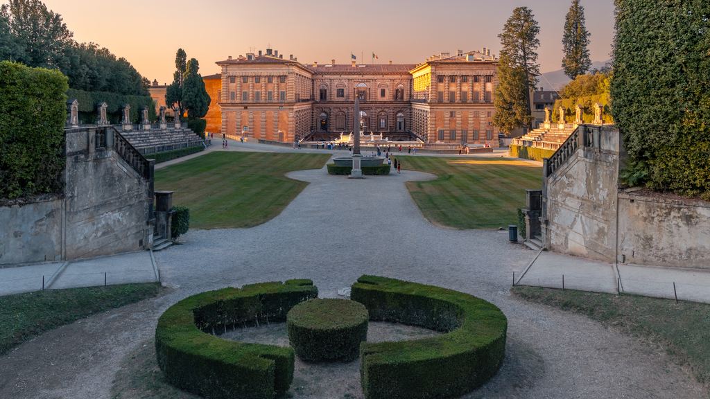 The long front of Palazzo Pitti seen across the box parterre of the Boboli Gardens in the last light of the day.