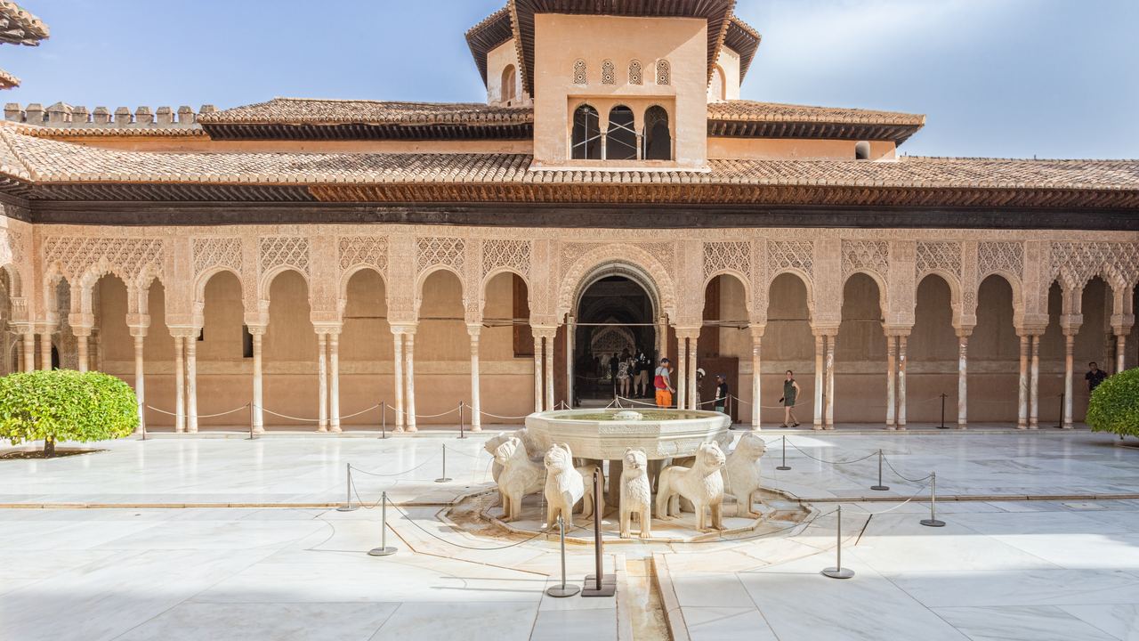 The Court of the Lions in the Nasrid Palaces of the Alhambra, with its fountain and carved pavilion.