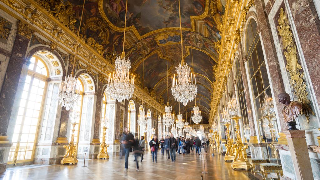 The Hall of Mirrors at Versailles, its painted vault and chandeliers running the length of the gallery.