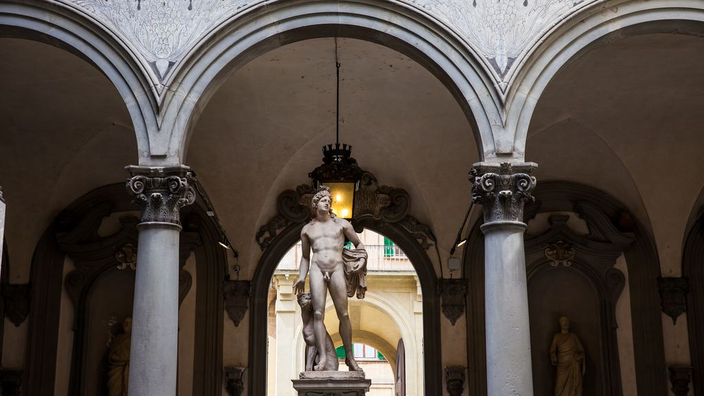 The arcaded courtyard of Palazzo Medici Riccardi in Florence, with Bandinelli's Orpheus standing under the arches.